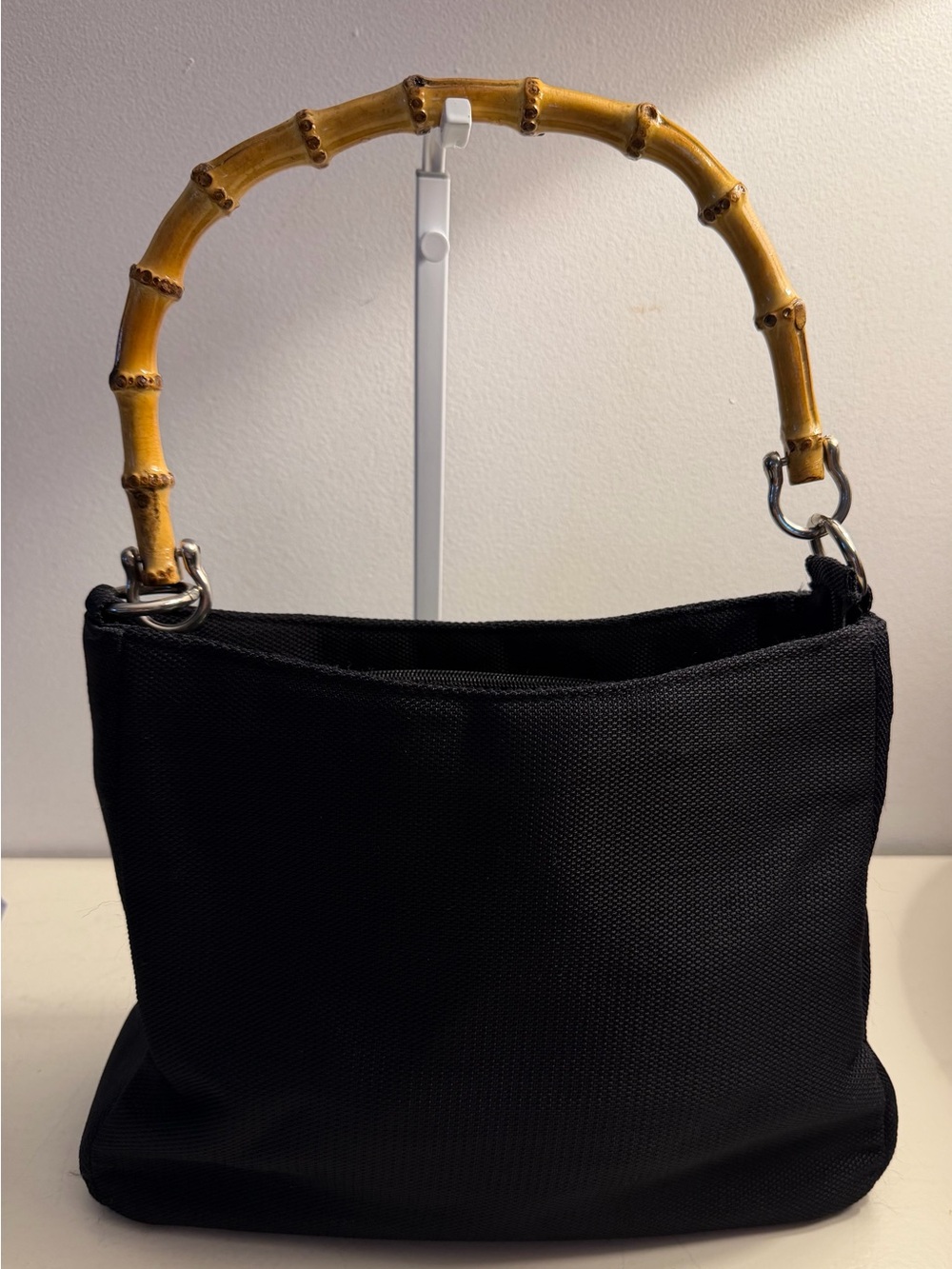 Naturalizer woven nylon bag with bamboo style handle.